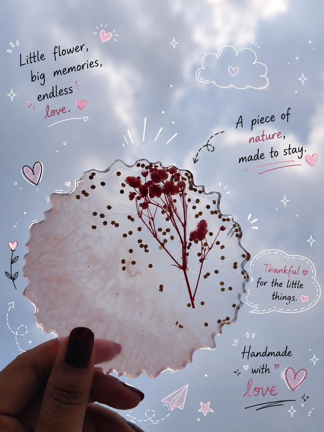 Blush resin keepsake with pressed red flowers and hand-drawn details